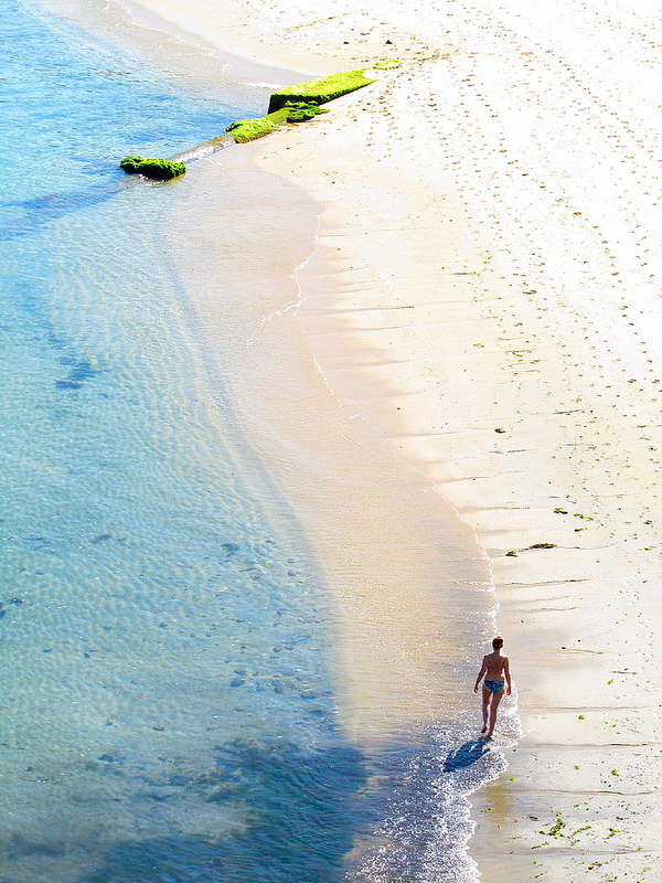 Woman Walks on Beach